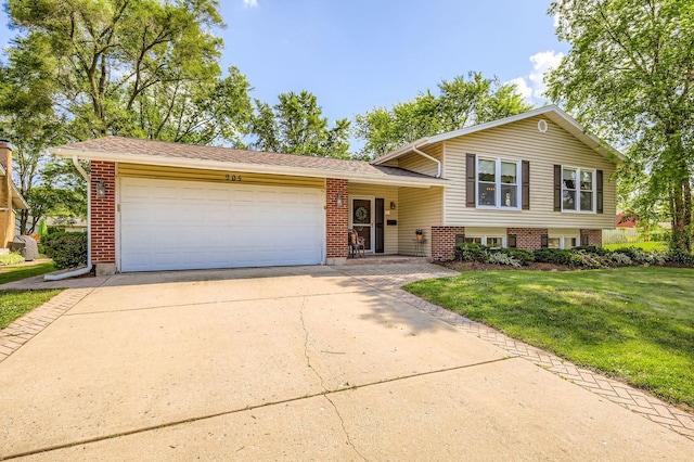 905 Harrison Ln, Hoffman Estates, IL 60192 - tri-level home with a garage, driveway, a front yard, and brick siding
