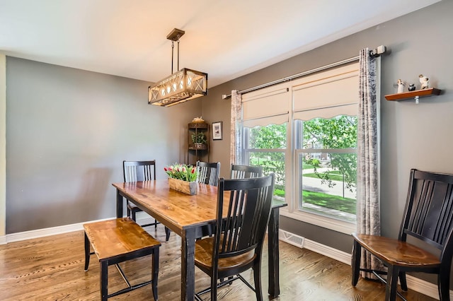 905 Harrison Ln, Hoffman Estates, IL 60192 - dining space featuring wood finished floors and a chandelier