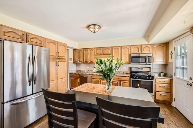 905 Harrison Ln, Hoffman Estates, IL 60192 - kitchen with stainless steel appliances, tasteful backsplash, and dark wood-style flooring