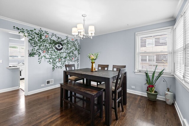 10341 Canterbury St, Westchester, IL 60154 - dining area with a chandelier, wood finished floors, plenty of natural light, and ornamental molding