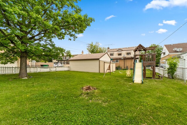 10341 Canterbury St, Westchester, IL 60154 - fenced backyard featuring a playground and an outdoor structure