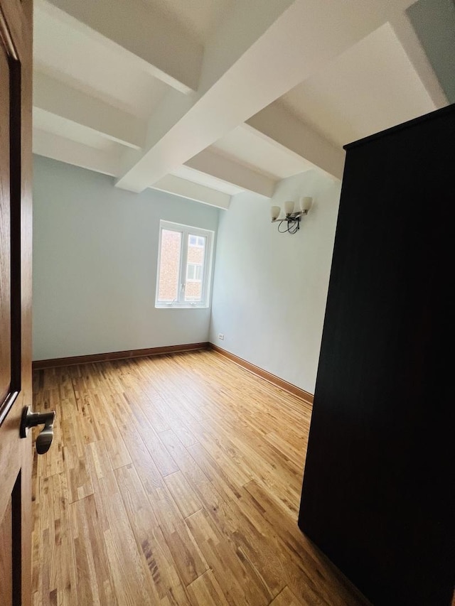 1950 W Hood Ave Unit 4C, Chicago, IL 60660 - spare room featuring beam ceiling and wood finished floors