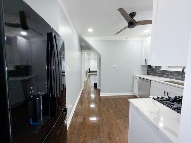 7252 S Wood St, Chicago, IL 60636 - kitchen with black refrigerator with ice dispenser, dishwasher, dark wood-style floors, white cabinetry, and a ceiling fan