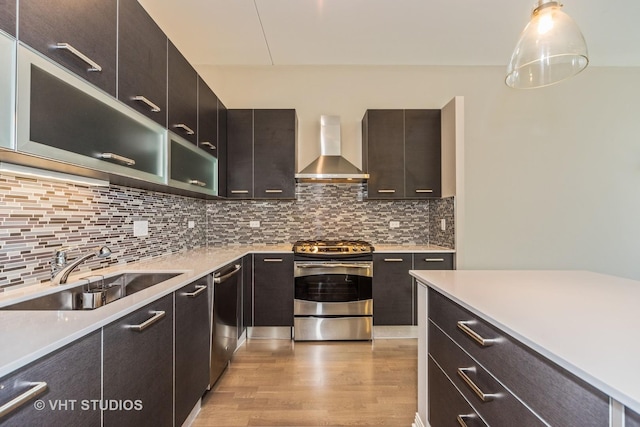 65 E Monroe St Unit 4010, Chicago, IL 60603 - kitchen with wall chimney range hood, stainless steel appliances, light wood-type flooring, and light countertops