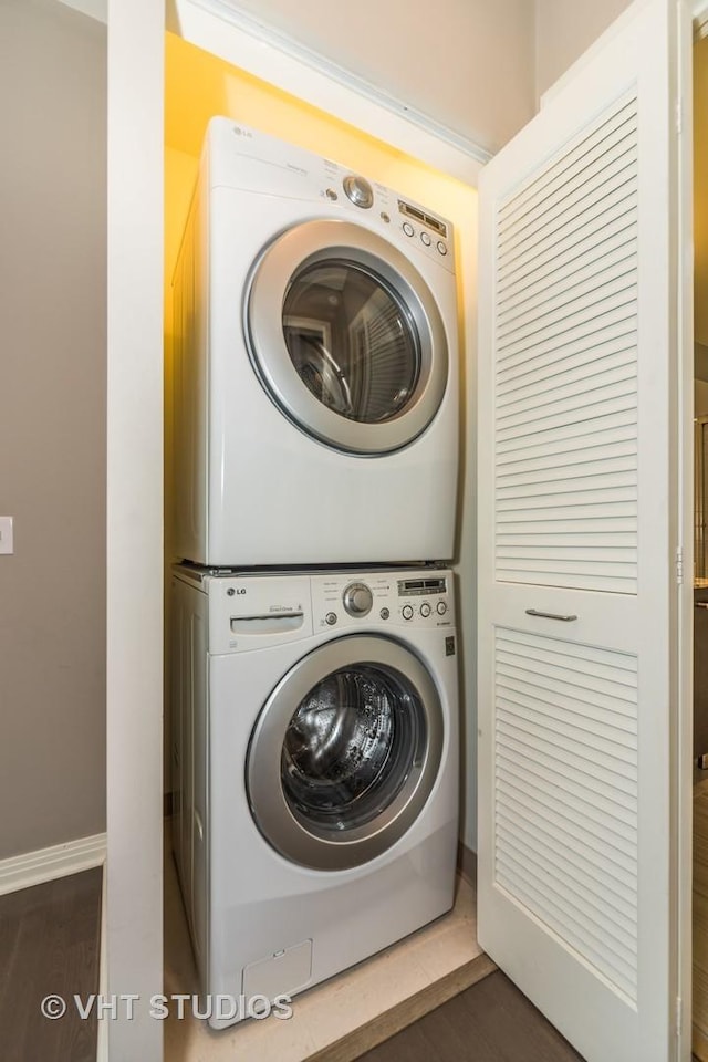 65 E Monroe St Unit 4010, Chicago, IL 60603 - laundry room featuring stacked washer / drying machine and wood finished floors