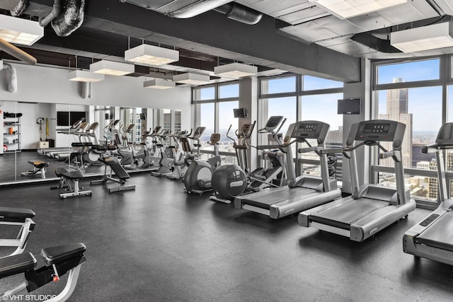 65 E Monroe St Unit 4010, Chicago, IL 60603 - exercise room with healthy amount of natural light and a wall of windows