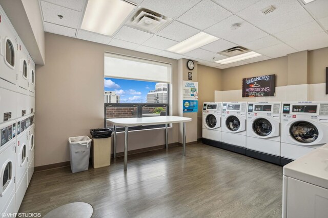 1250 N Dearborn St Unit 16B, Chicago, IL 60610 - shared laundry featuring stacked washer and clothes dryer, washer and dryer, and wood finished floors