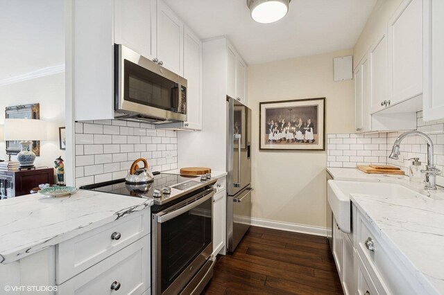 1250 N Dearborn St Unit 16B, Chicago, IL 60610 - kitchen featuring stainless steel appliances, white cabinetry, and backsplash