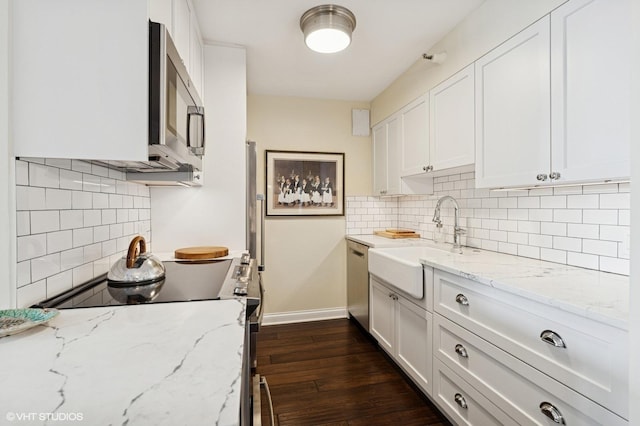 1250 N Dearborn St Unit 16B, Chicago, IL 60610 - kitchen with stainless steel appliances, tasteful backsplash, dark wood-style flooring, and white cabinetry