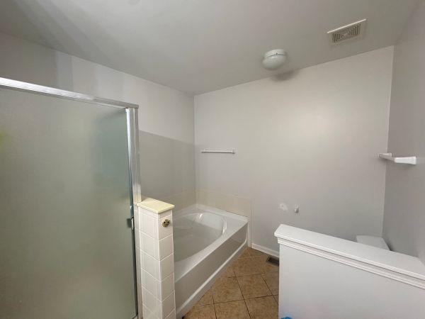 475 Lancaster Dr, Pingree Grove, IL 60140 - bathroom featuring tile patterned flooring, a bath, and a stall shower