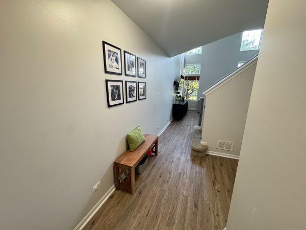 475 Lancaster Dr, Pingree Grove, IL 60140 - corridor with wood finished floors, lofted ceiling, and stairs