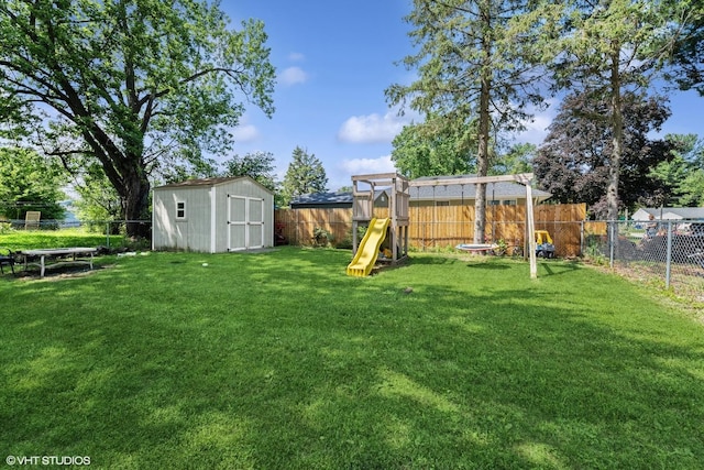 1923 Barbara Ln, South Beloit, IL 61080 - fenced backyard with a playground and a storage shed