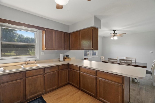 1514 N N Ave, Mchenry, IL 60050 - kitchen with a ceiling fan, a peninsula, light wood finished floors, and light countertops