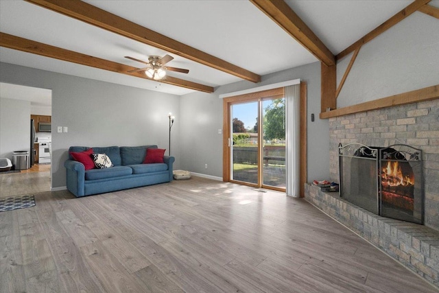 1514 N N Ave, Mchenry, IL 60050 - living area with beam ceiling, wood finished floors, a brick fireplace, and ceiling fan