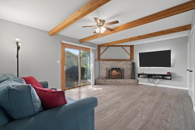 1514 N N Ave, Mchenry, IL 60050 - living area featuring beam ceiling, wood finished floors, ceiling fan, and a brick fireplace