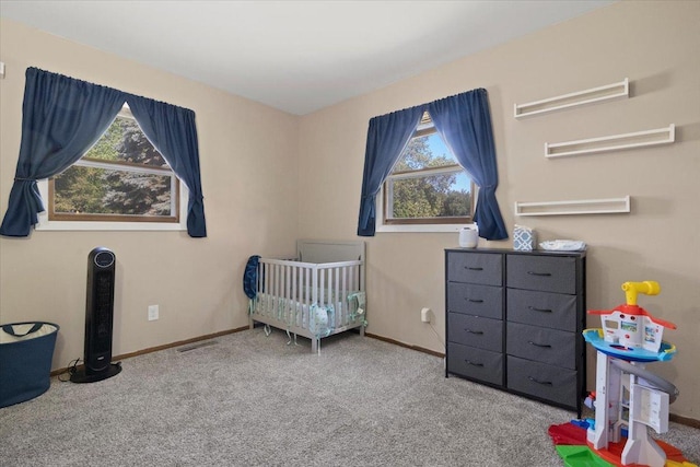 1514 N N Ave, Mchenry, IL 60050 - carpeted bedroom featuring a crib and baseboards
