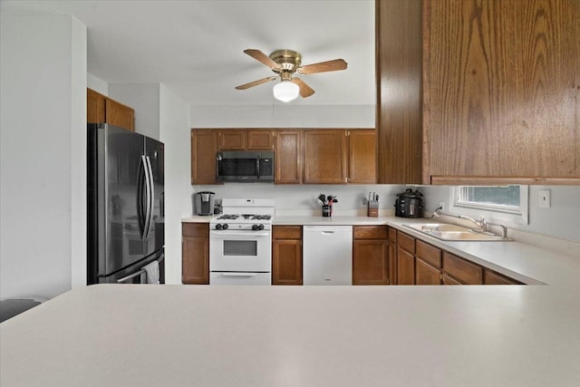 1514 N N Ave, Mchenry, IL 60050 - kitchen with white appliances, a ceiling fan, brown cabinetry, and light countertops
