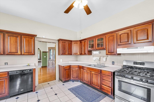 301 N Main St, Fithian, IL 61844 - kitchen with dishwasher, stainless steel range with gas cooktop, under cabinet range hood, and light countertops