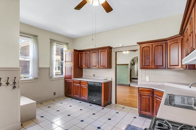 301 N Main St, Fithian, IL 61844 - kitchen with dishwasher, ceiling fan, a wainscoted wall, and light countertops