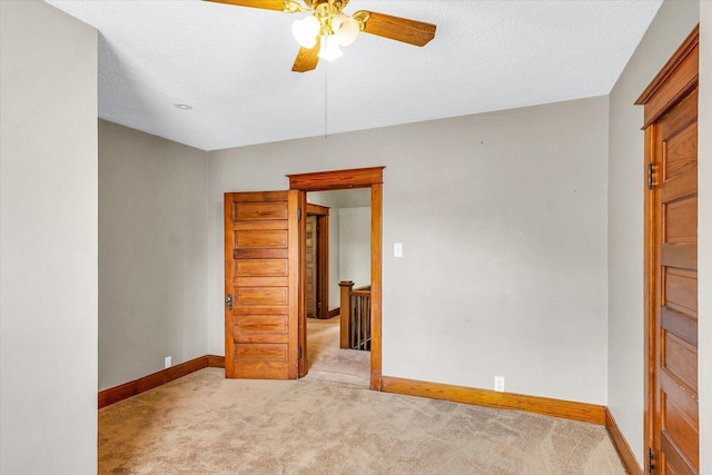 301 N Main St, Fithian, IL 61844 - carpeted empty room featuring baseboards and ceiling fan