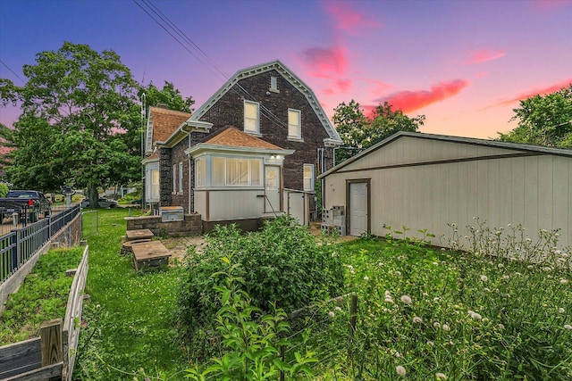 301 N Main St, Fithian, IL 61844 - back of house at dusk with brick siding