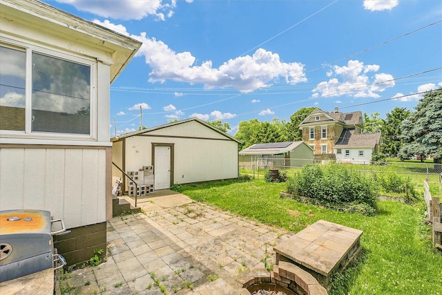 301 N Main St, Fithian, IL 61844 - fenced backyard with a patio and an outdoor structure