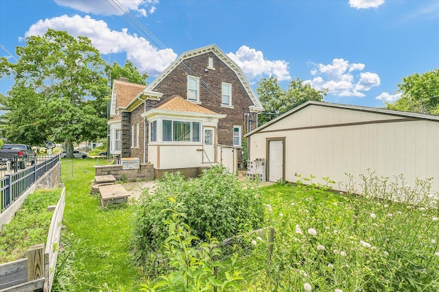 301 N Main St, Fithian, IL 61844 - rear view of property with a shingled roof