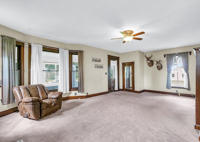 301 N Main St, Fithian, IL 61844 - unfurnished living room featuring ceiling fan and carpet floors