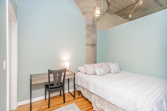 1070 W 15th St Unit 105, Chicago, IL 60608 - bedroom with wood finished floors and baseboards