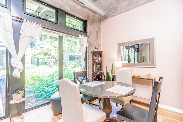 1070 W 15th St Unit 105, Chicago, IL 60608 - dining space featuring light wood-style floors and a towering ceiling