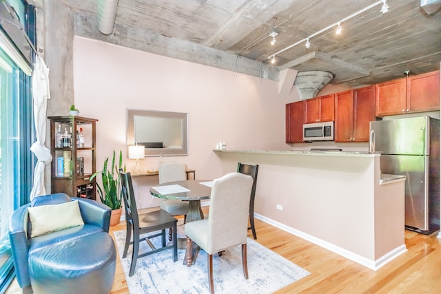 1070 W 15th St Unit 105, Chicago, IL 60608 - dining space featuring rail lighting and light wood-style floors