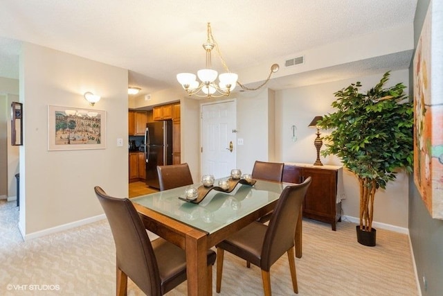 511 Aurora Ave Unit 405, Naperville, IL 60540 - dining area with a chandelier and light colored carpet