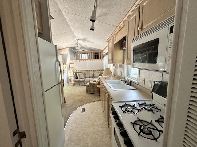 268 Fossil Bay Ct, Wilmington, IL 60481 - kitchen with white appliances, lofted ceiling, open floor plan, a ceiling fan, and plenty of natural light