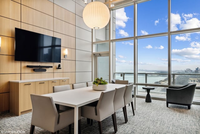 340 E Randolph St Unit 803, Chicago, IL 60601 - dining room featuring floor to ceiling windows and light colored carpet