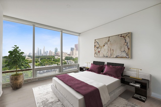 340 E Randolph St Unit 803, Chicago, IL 60601 - bedroom with wood finished floors, a view of skyline, and expansive windows
