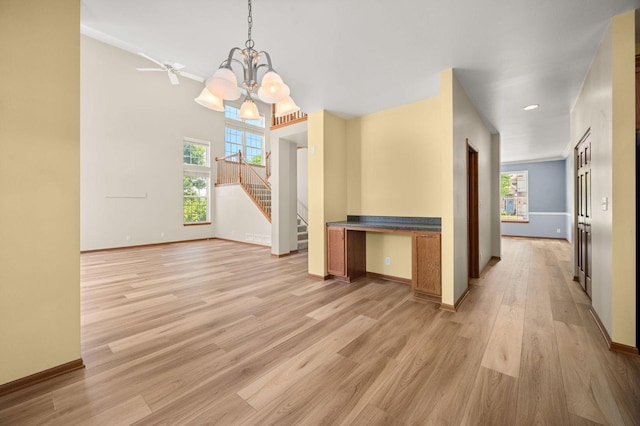 619 Northgate Dr, Sycamore, IL 60178 - unfurnished dining area with a chandelier, plenty of natural light, stairs, light wood-type flooring, and recessed lighting