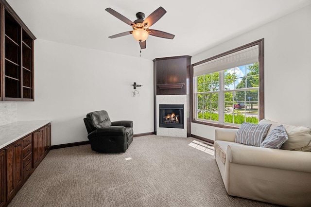 619 Northgate Dr, Sycamore, IL 60178 - living room featuring a glass covered fireplace, light colored carpet, and ceiling fan