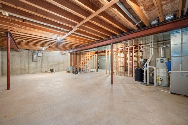 619 Northgate Dr, Sycamore, IL 60178 - unfinished below grade area featuring water heater and stairs