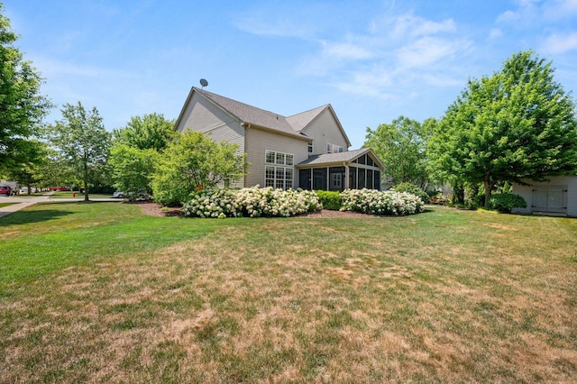 619 Northgate Dr, Sycamore, IL 60178 - view of grassy yard featuring a sunroom