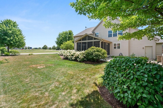 619 Northgate Dr, Sycamore, IL 60178 - view of grassy yard with a sunroom