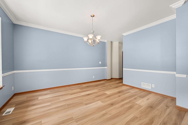619 Northgate Dr, Sycamore, IL 60178 - spare room with a chandelier, wood finished floors, and ornamental molding
