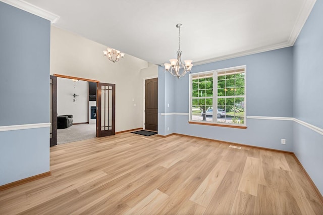 619 Northgate Dr, Sycamore, IL 60178 - empty room featuring a chandelier, wood finished floors, and ornamental molding