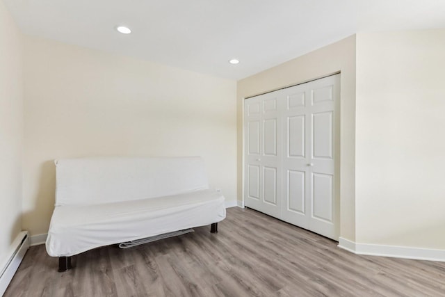 9250 Noel Ave Unit 205E, Des Plaines, IL 60016 - living area with baseboard heating, wood finished floors, and recessed lighting