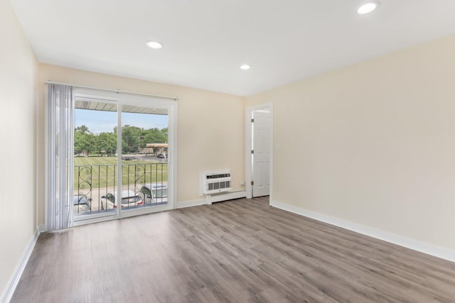 9250 Noel Ave Unit 205E, Des Plaines, IL 60016 - spare room featuring wood finished floors, recessed lighting, and heating unit
