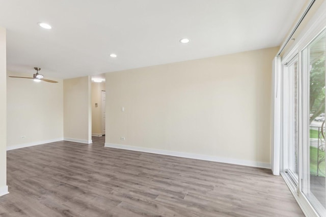 9250 Noel Ave Unit 205E, Des Plaines, IL 60016 - spare room with wood finished floors, a ceiling fan, and recessed lighting