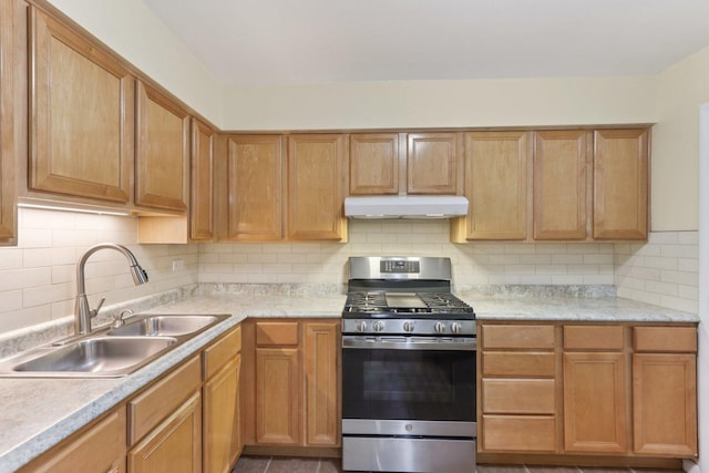 9250 Noel Ave Unit 205E, Des Plaines, IL 60016 - kitchen with stainless steel gas range oven, under cabinet range hood, light countertops, and decorative backsplash