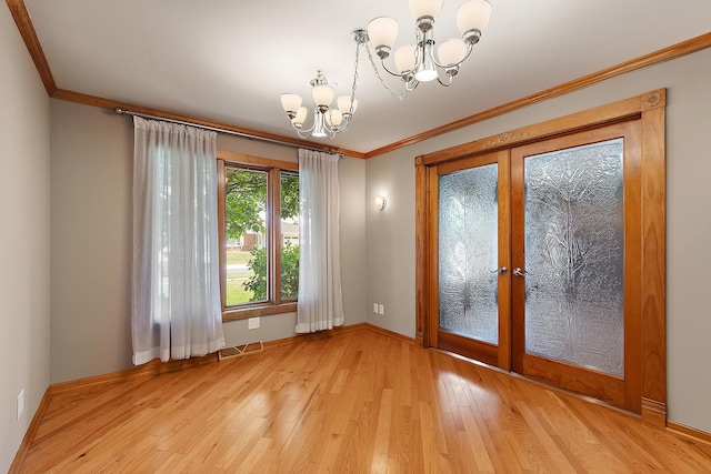 7637 Sequoia Ct, Orland Park, IL 60462 - unfurnished room with a chandelier, french doors, light wood finished floors, and ornamental molding