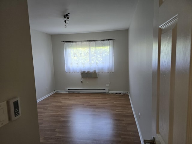 836 E Old Willow Rd Unit 109, Prospect Heights, IL 60070 - spare room with baseboard heating and wood finished floors