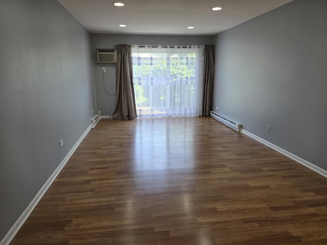 836 E Old Willow Rd Unit 109, Prospect Heights, IL 60070 - spare room featuring baseboard heating, recessed lighting, a wall mounted air conditioner, and dark wood-type flooring