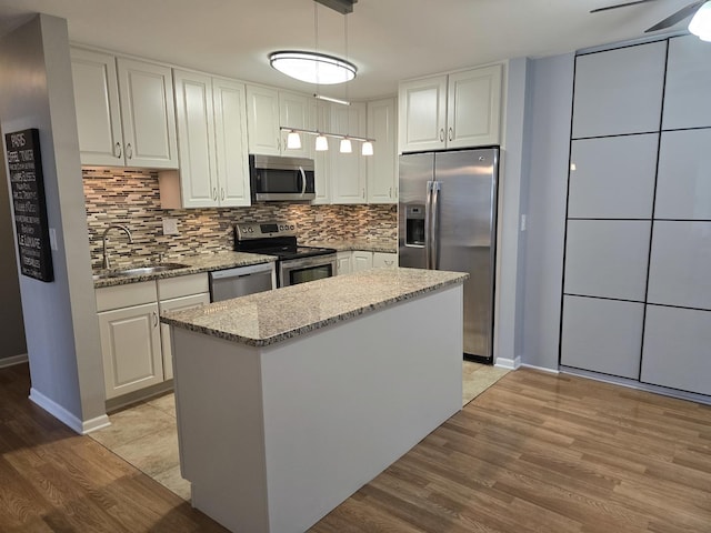 836 E Old Willow Rd Unit 109, Prospect Heights, IL 60070 - kitchen featuring stainless steel appliances, white cabinetry, decorative backsplash, and light wood finished floors